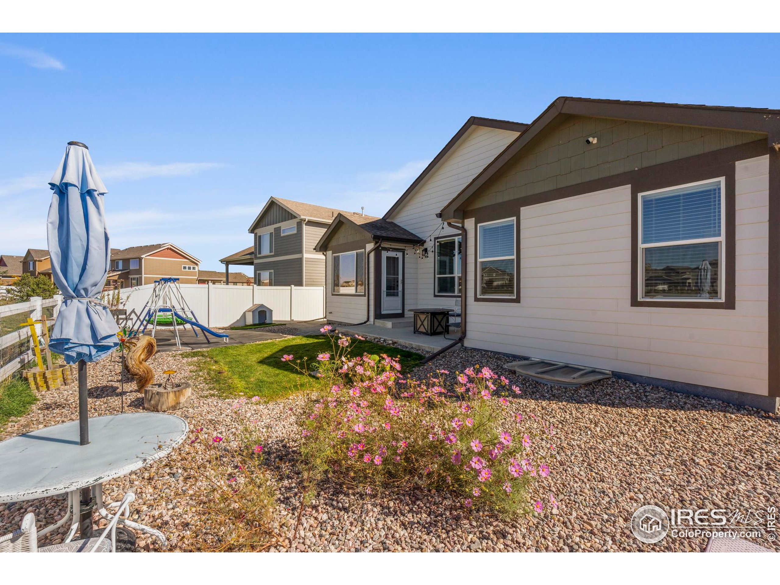 941 Barasingha Street Severance, CO 80550 - Photo 34 of 46 a front view of a house with a yard