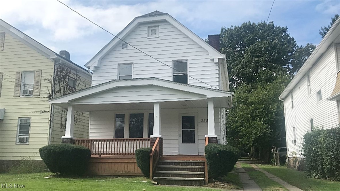 3554 Bosworth Road Cleveland, OH 44111 - Photo 1 of 2 View of front facade featuring a front yard and covered porch