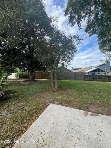 a view of a yard with tree s