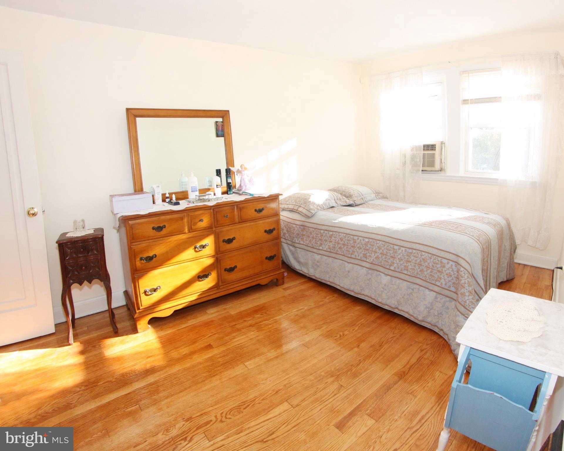 204 Old Riverside Road Baltimore, MD 21225 - Photo 11 of 24 a bedroom with a bed and window