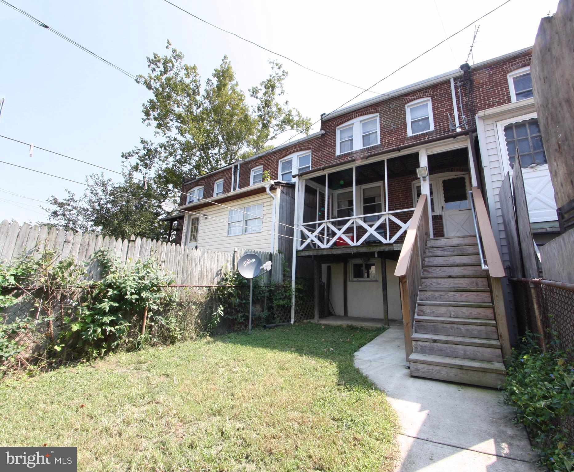 204 Old Riverside Road Baltimore, MD 21225 - Photo 23 of 24 a front view of a house with garden