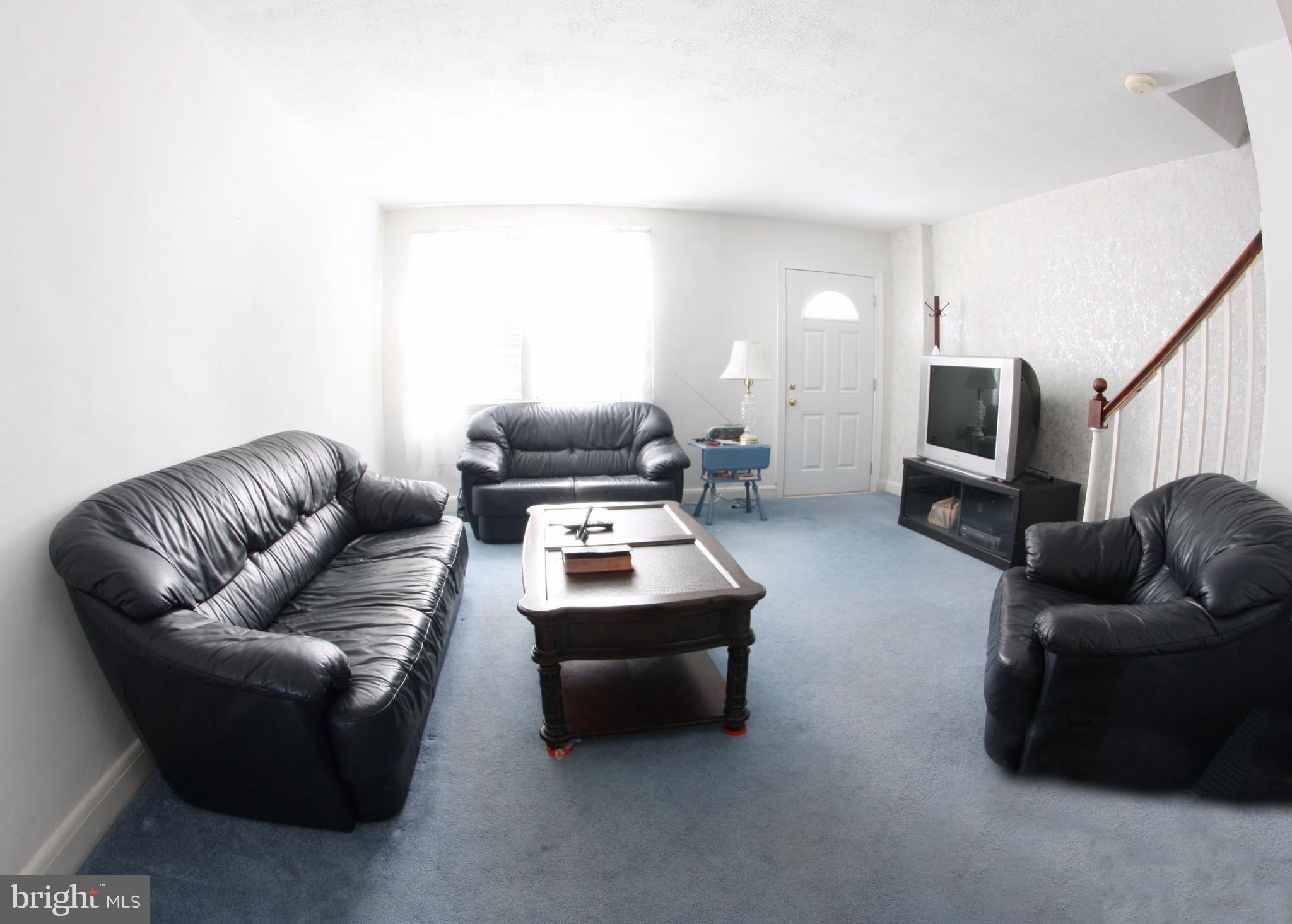 204 Old Riverside Road Baltimore, MD 21225 - Photo 8 of 24 a living room with furniture and a flat screen tv