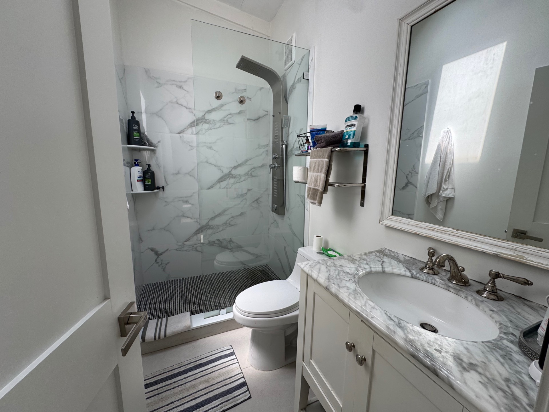 16 Fern Road Southampton, NY 11968 - Photo 7 of 9 a bathroom with a granite countertop sink toilet and shower