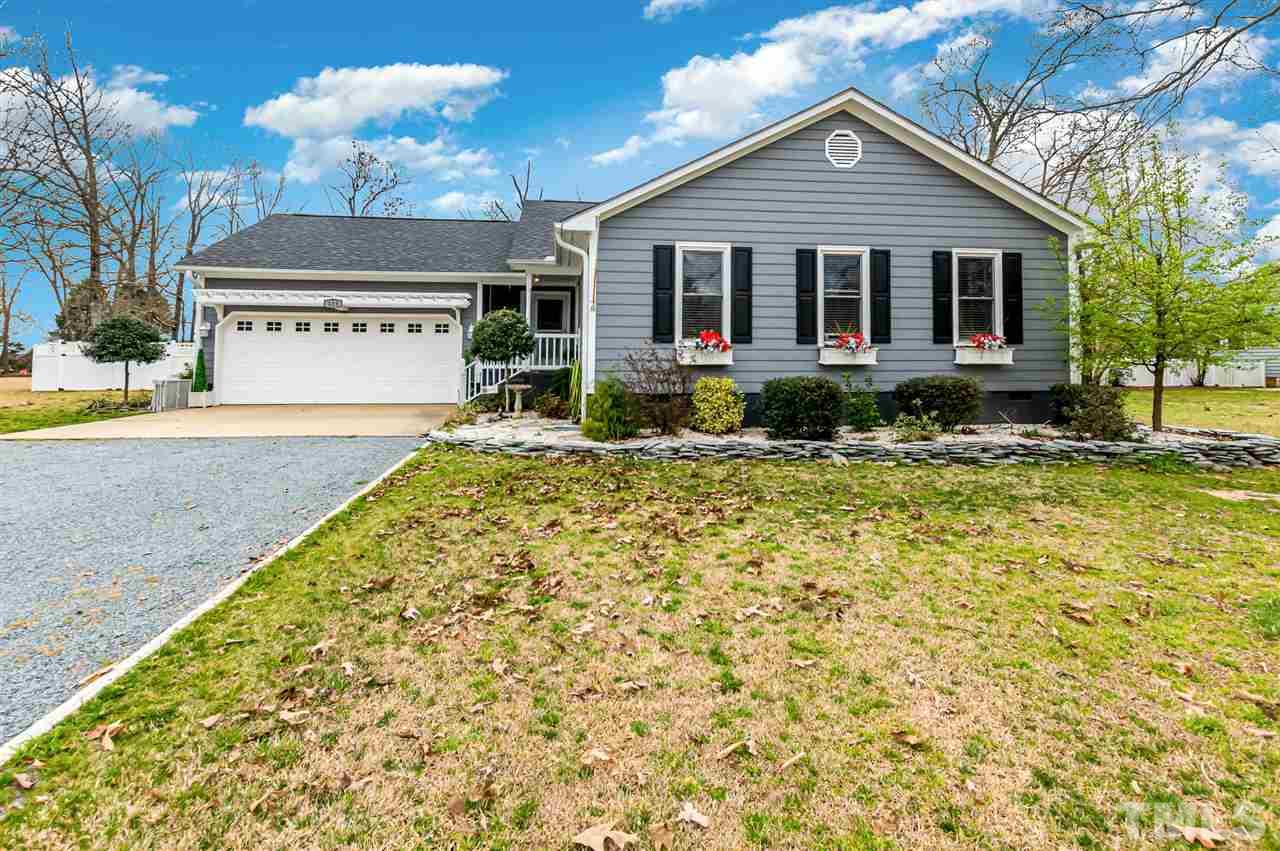 113 Tanning Ridge Drive Dunn, NC 28334 - Photo 1 of 28 a front view of a house with a yard
