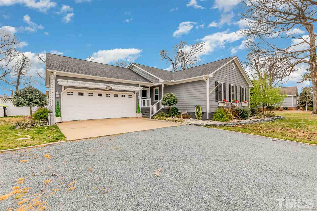 113 Tanning Ridge Drive Dunn, NC 28334 - Photo 2 of 28 a view of a house with a yard and garage