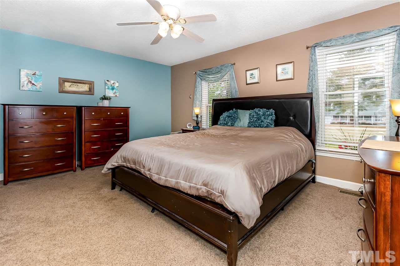 113 Tanning Ridge Drive Dunn, NC 28334 - Photo 18 of 28 a bedroom with a bed and a dresser
