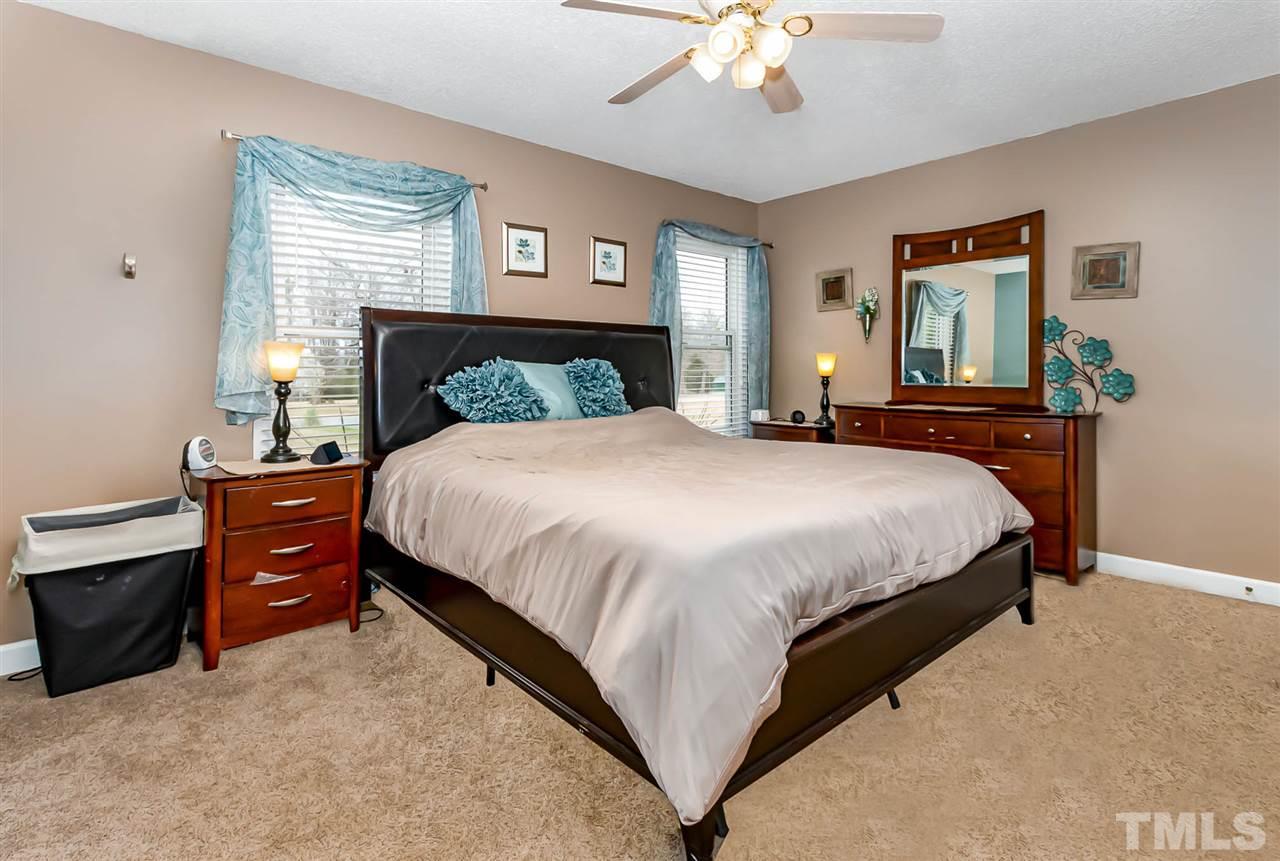 113 Tanning Ridge Drive Dunn, NC 28334 - Photo 19 of 28 a bedroom with a bed and window