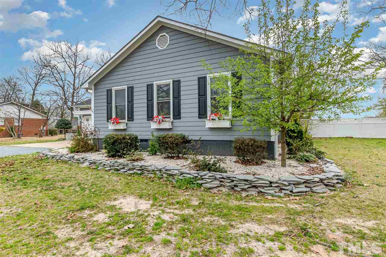 113 Tanning Ridge Drive Dunn, NC 28334 - Photo 3 of 28 a front view of a house with garden