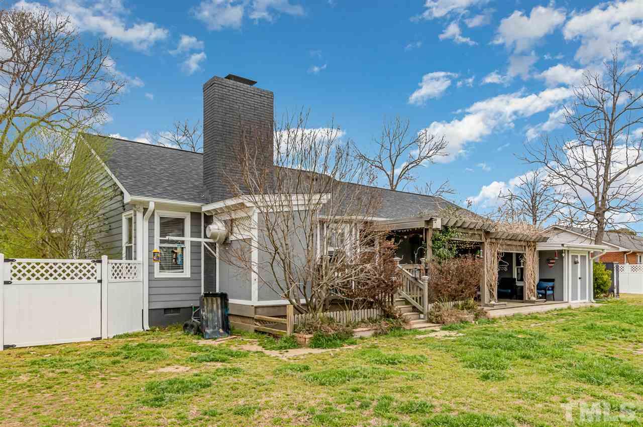113 Tanning Ridge Drive Dunn, NC 28334 - Photo 27 of 28 a view of a house with backyard and garden