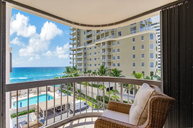 a living room with furniture and a glass door