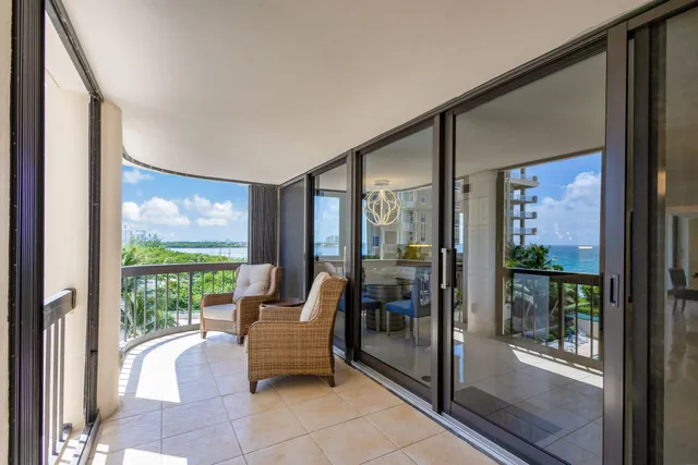 a view of a yard with wooden fence