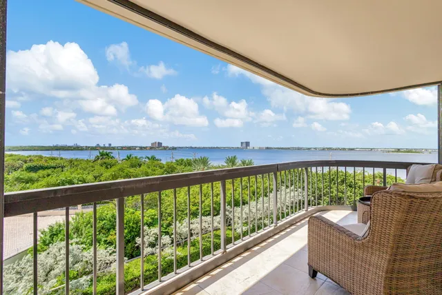a kitchen view with stainless steel appliances granite countertop a sink and a refrigerator