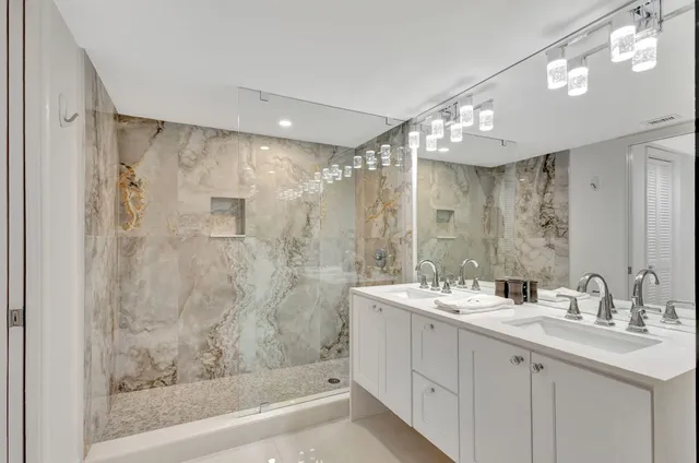 a bathroom with a shower and toilet