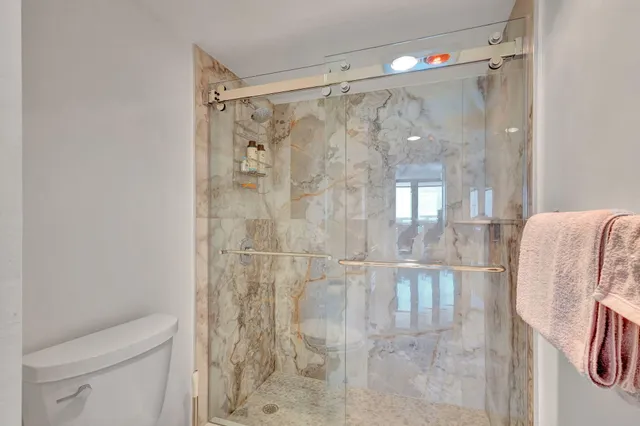 a front view of a multi story building with yard