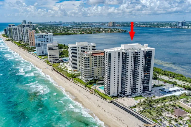 an aerial view of a house with swimming pool garden and patio