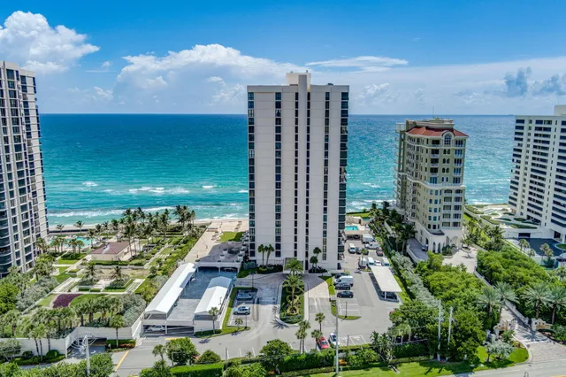 a view of a patio with chairs and a yard