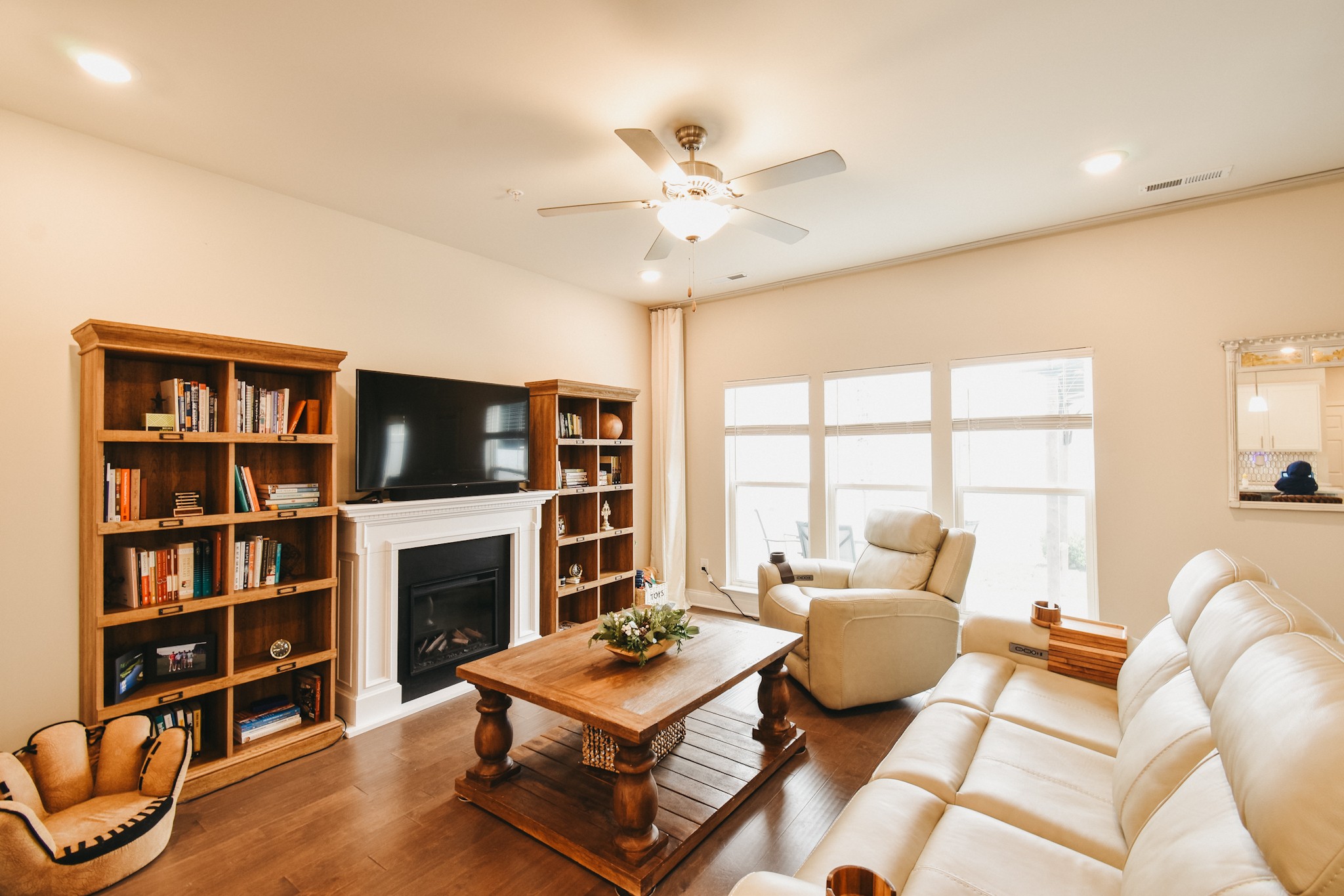 1251 June Wilde Ridge Spring Hill, TN 37174 - Photo 22 of 75 a living room with furniture a flat screen tv and a fireplace