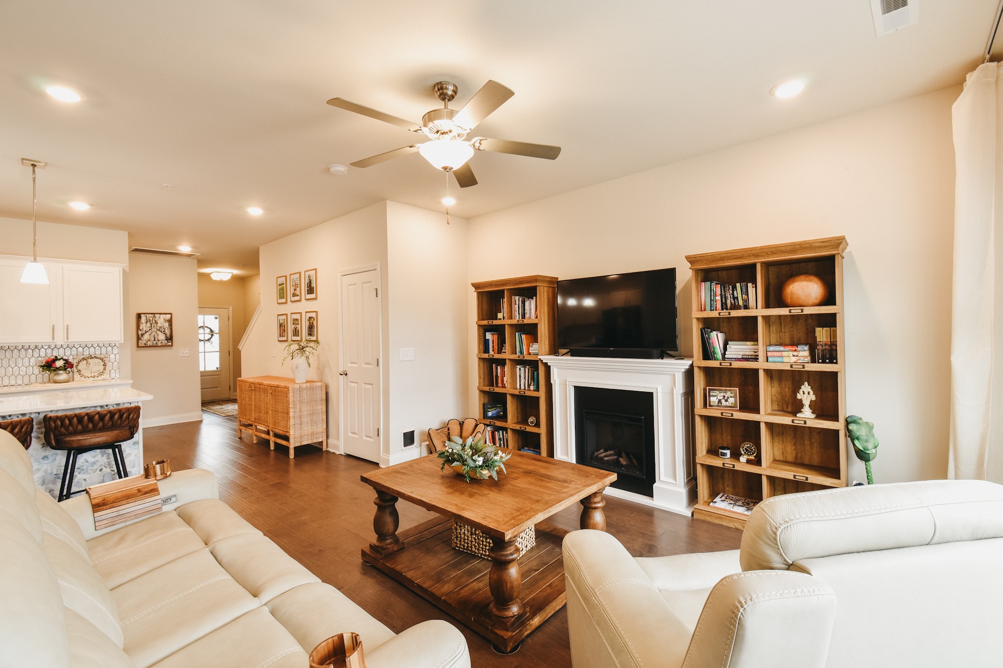 1251 June Wilde Ridge Spring Hill, TN 37174 - Photo 24 of 75 a living room with furniture a flat screen tv and a fireplace