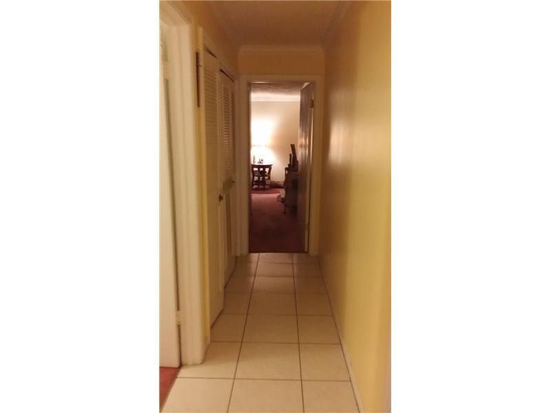 22173 Southwest 61st Avenue Boca Raton, FL 33428 - Photo 10 of 17 a view of a hallway with a white walls