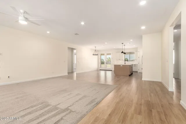 a view of a kitchen with a sink and wooden floor