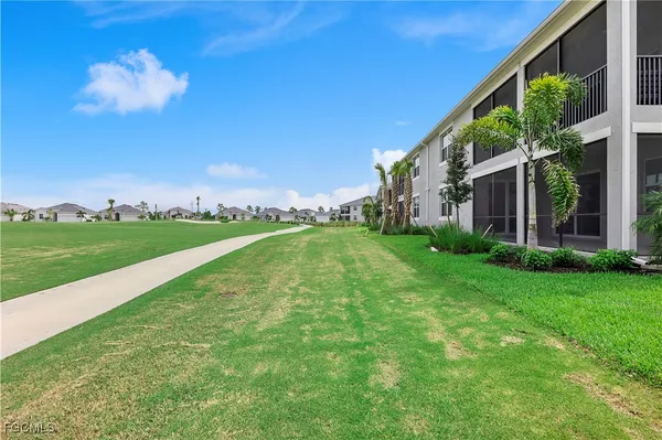 a view of a building with a big yard