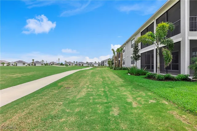 a view of a building with a big yard