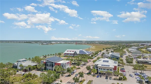 an aerial view of a house with lake view