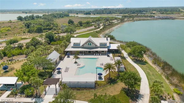 an aerial view of a house with a lake view