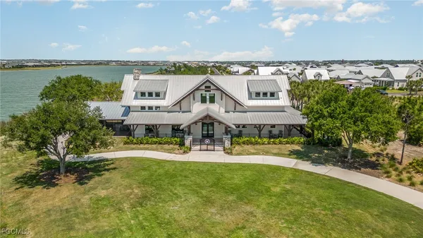 an aerial view of a house with a garden and deck