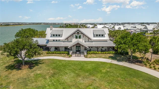 an aerial view of a house with a garden and deck