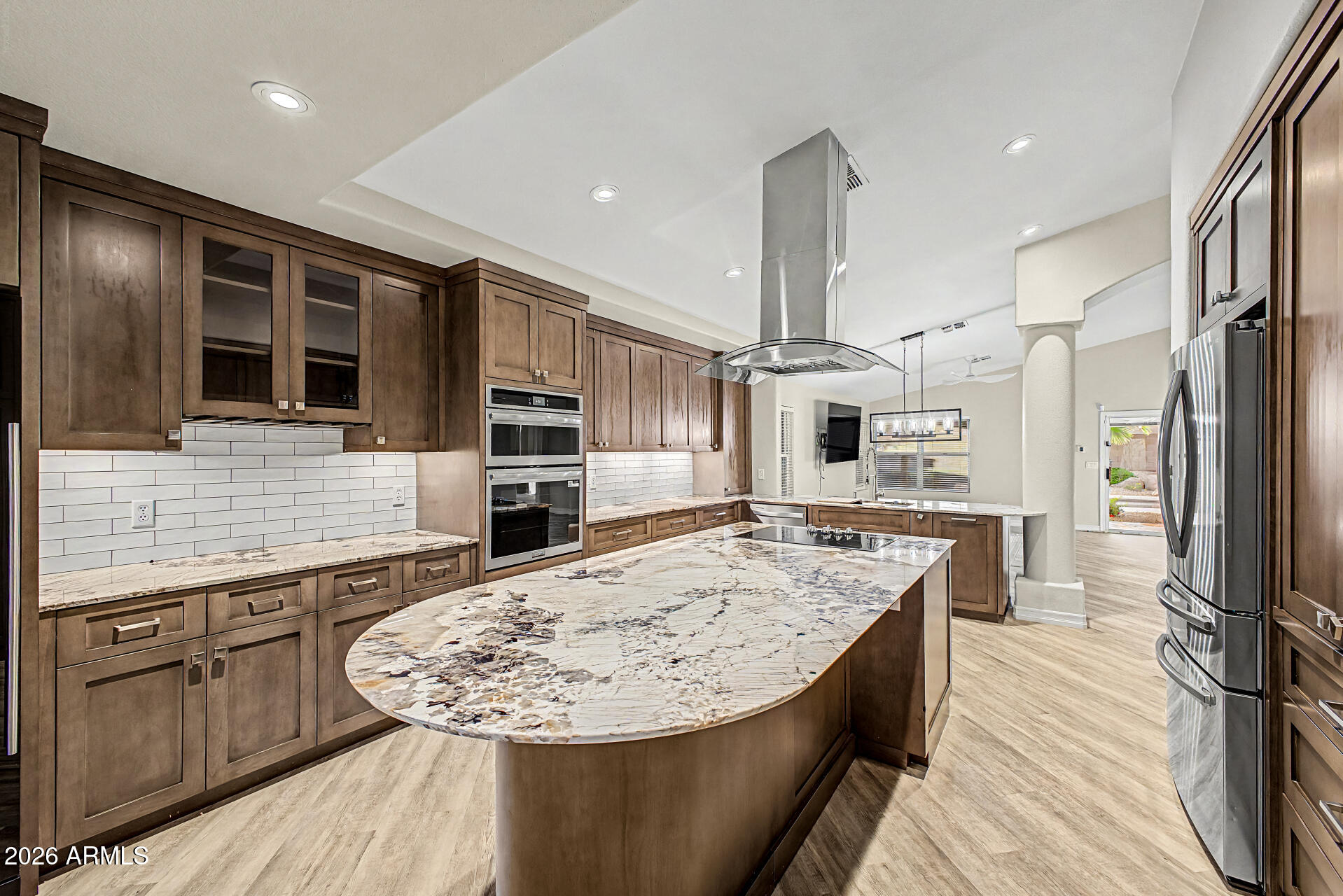 4102 East Rock Wren Road Phoenix, AZ 85044 - Photo 9 of 25 a kitchen with stainless steel appliances kitchen island granite countertop a stove refrigerator and cabinets