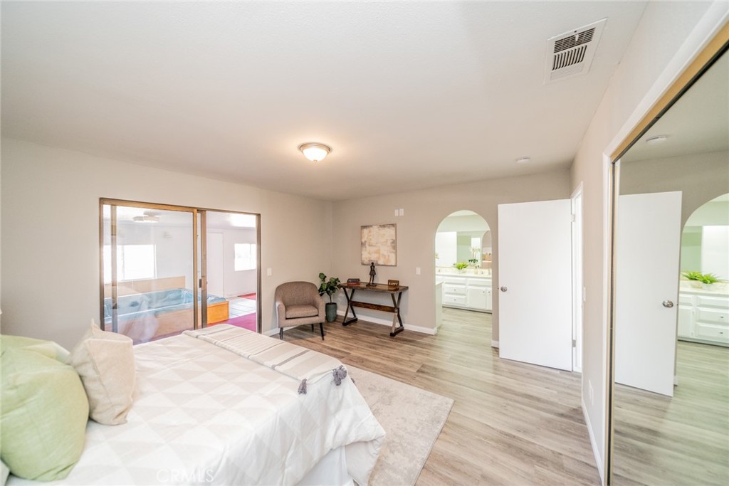 17470 Krameria Avenue Riverside, CA 92504 - Photo 21 of 53 a bedroom with a bed and a large window