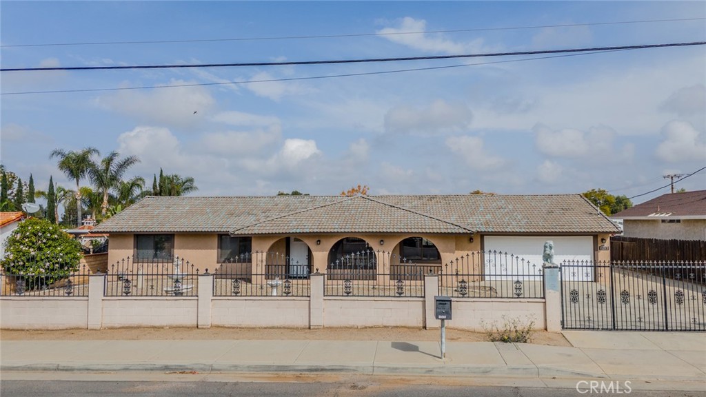 17470 Krameria Avenue Riverside, CA 92504 - Photo 47 of 53 a front view of a house with garden