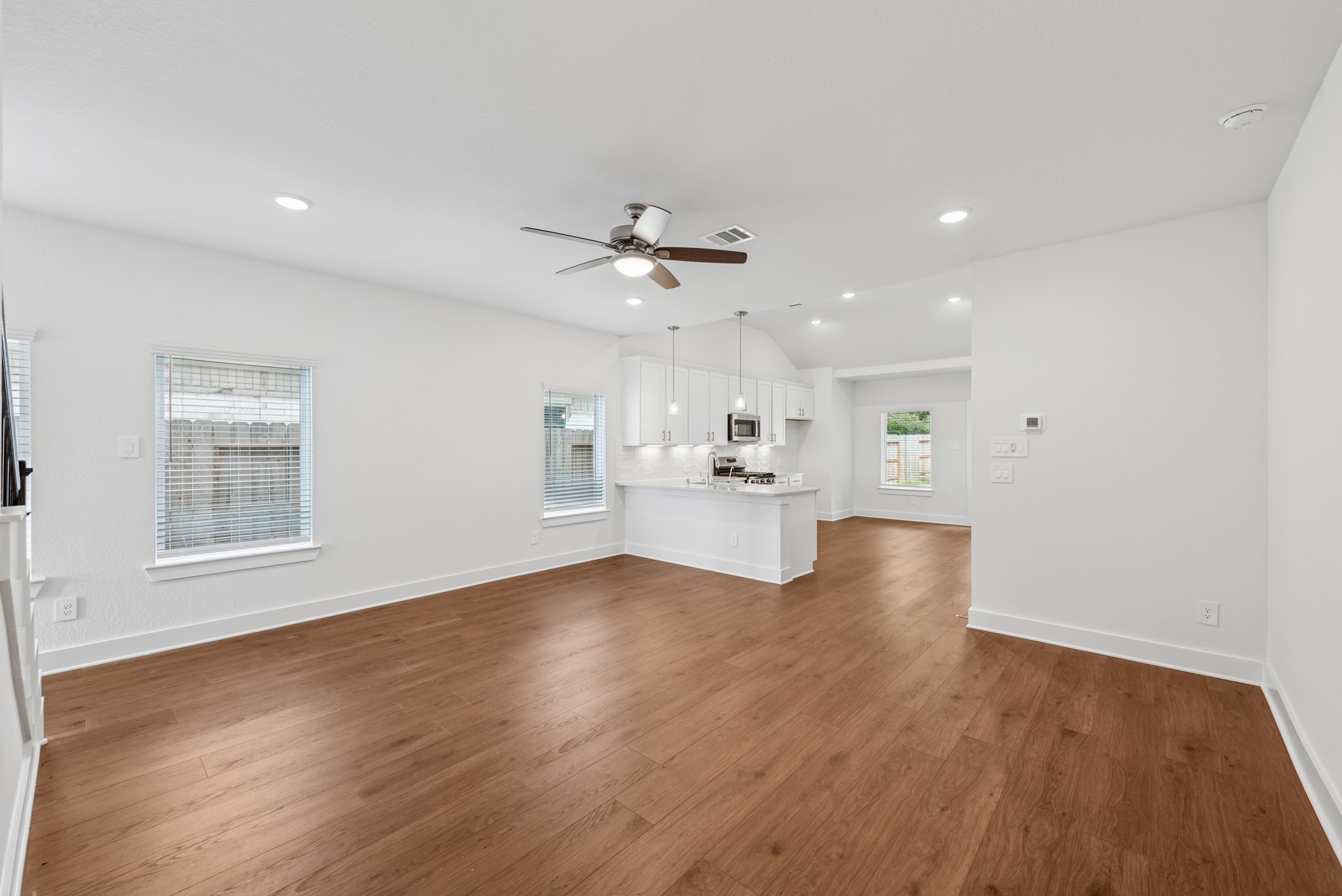20518 Draper Road Tomball, TX 77377 - Photo 20 of 46 a view of kitchen and hall with wooden floor