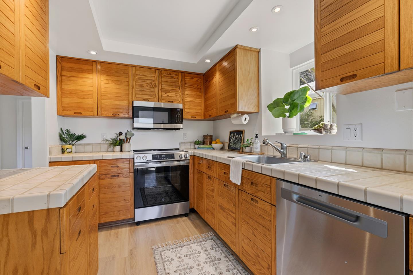 11 Berkeley Court Santa Cruz, CA 95062 - Photo 20 of 50 a kitchen with stainless steel appliances granite countertop a sink a stove and a refrigerator