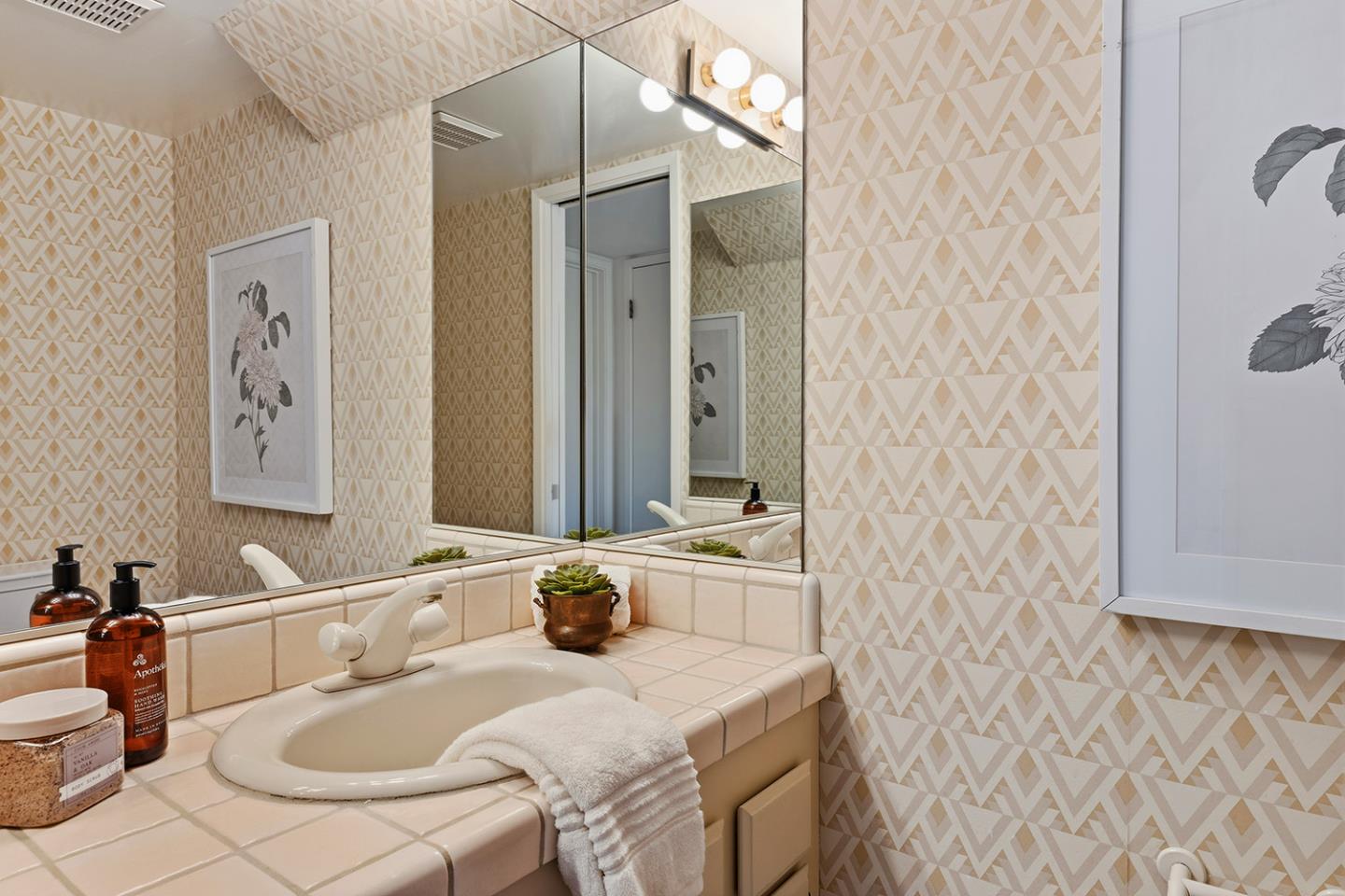 11 Berkeley Court Santa Cruz, CA 95062 - Photo 22 of 50 a bathroom with a sink and a mirror