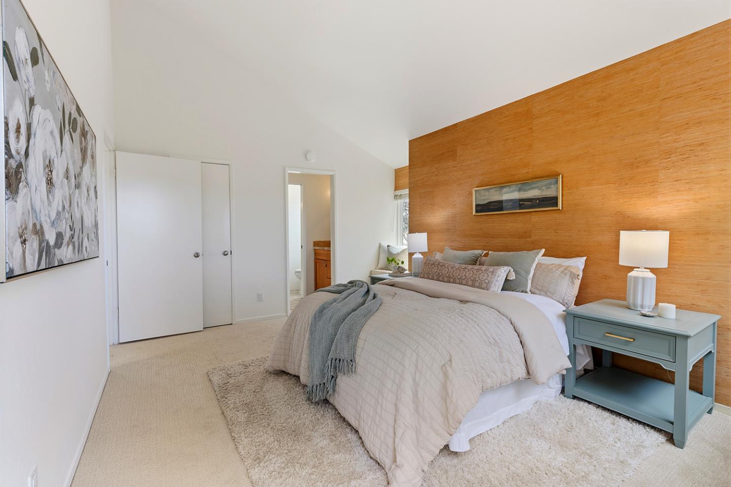 11 Berkeley Court Santa Cruz, CA 95062 - Photo 24 of 50 a spacious bedroom with a bed and a couch