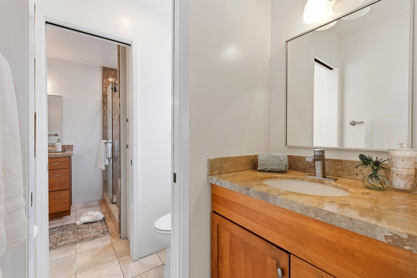 11 Berkeley Court Santa Cruz, CA 95062 - Photo 26 of 50 a bathroom with a granite countertop sink and a mirror