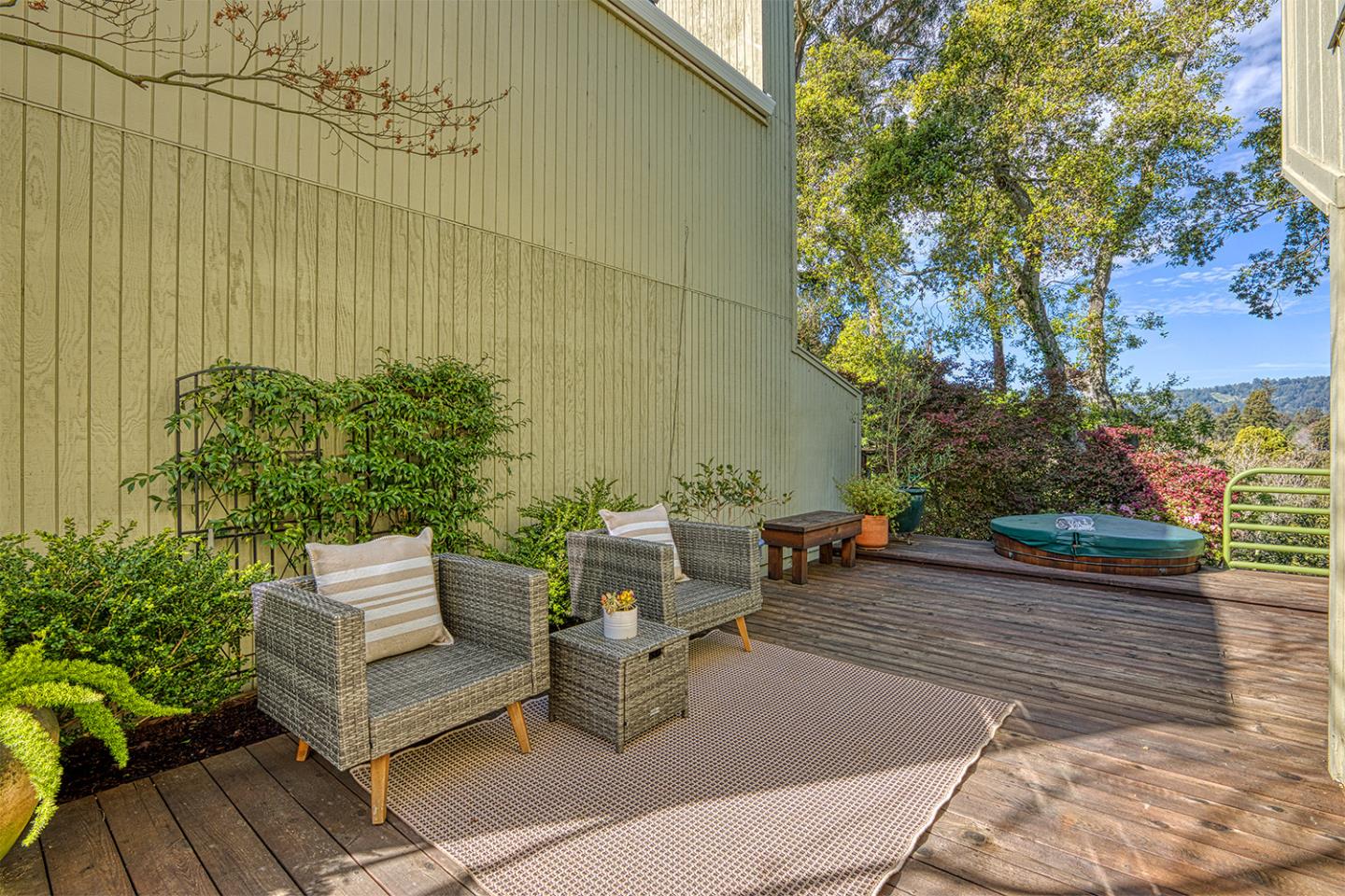 11 Berkeley Court Santa Cruz, CA 95062 - Photo 31 of 50 a view of a patio with couches and table and chairs with wooden floor and fence