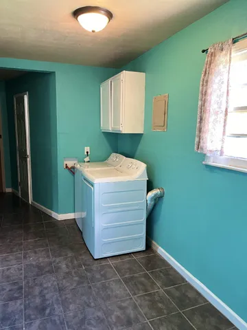 a bathroom with a sink a mirror and a vanity