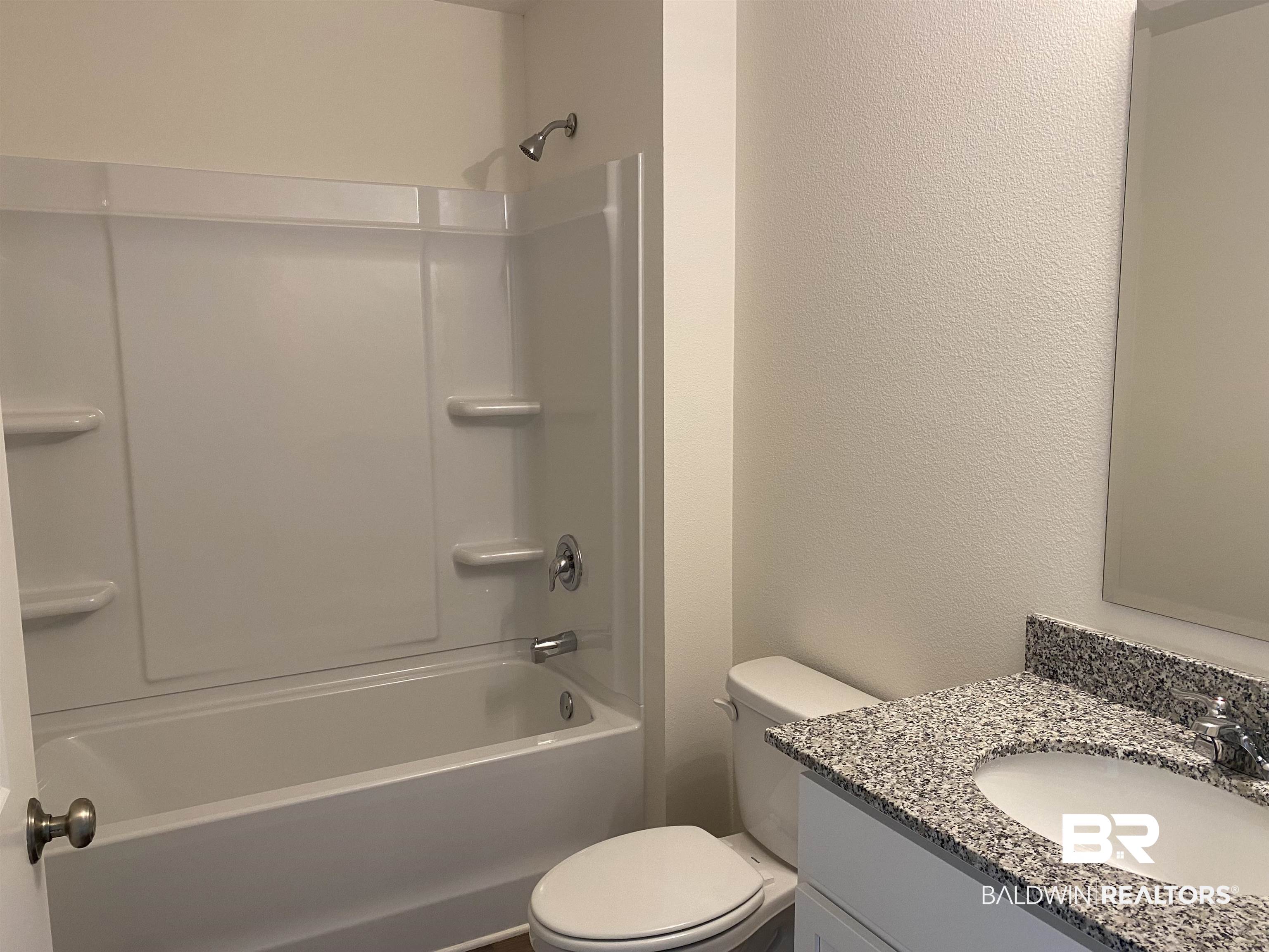 21641 Sutherland Circle Fairhope, AL 36532 - Photo 12 of 17 Full bathroom with shower / tub combination, toilet, and vanity
