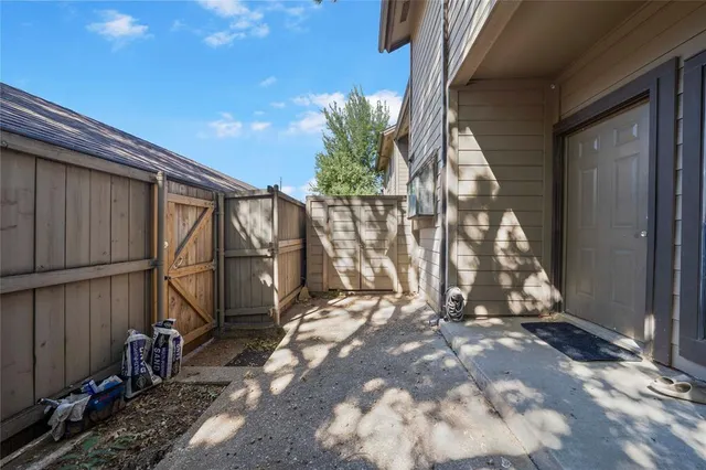 a view of a bench in the backyard