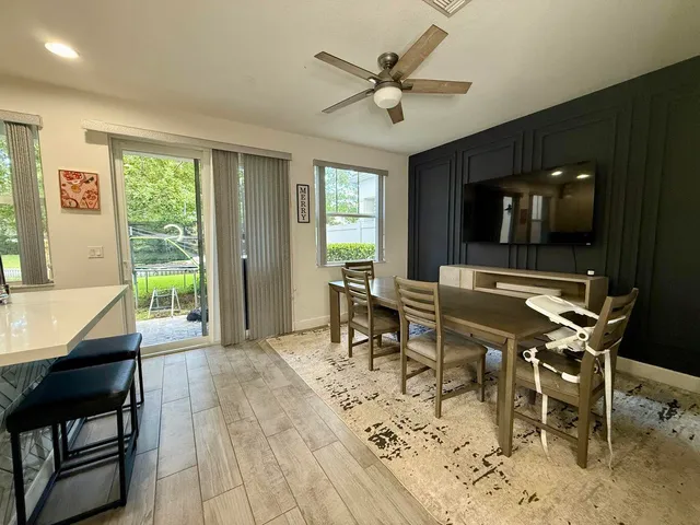 a view of a dining room with furniture window and outside view