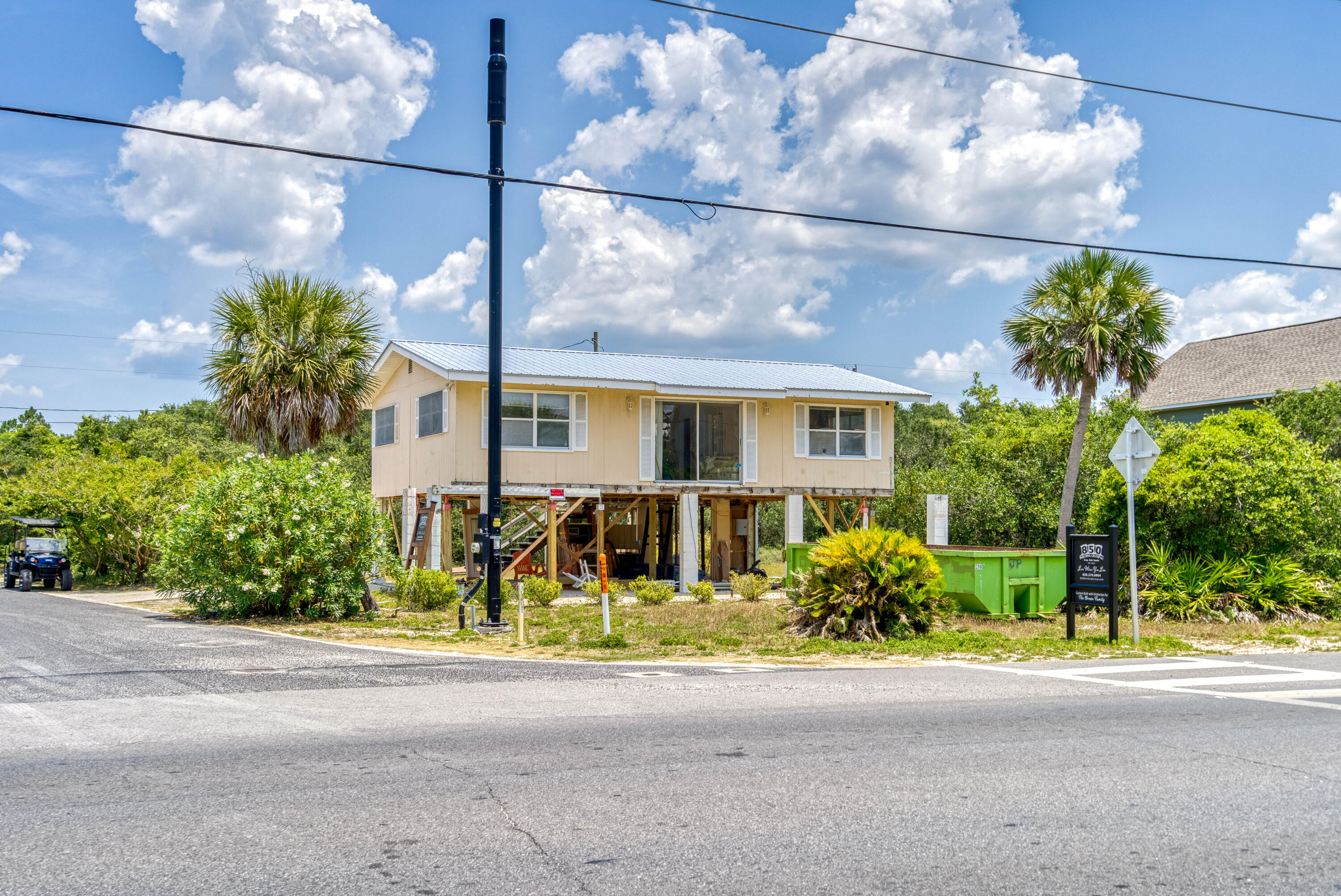 3139 East County Highway 30A Santa Rosa Beach, FL 32459 - Photo 13 of 16 a front view of a house with a yard and potted plants