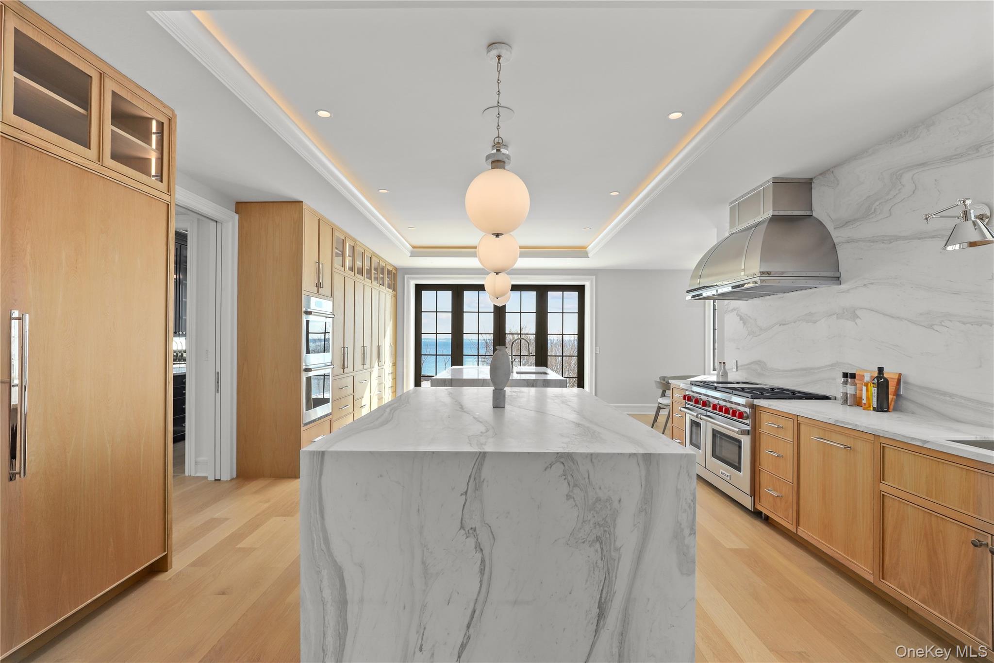 104 Premium Point Larchmont, NY 10538 - Photo 14 of 41 a kitchen with stainless steel appliances granite countertop a sink a stove and a refrigerator