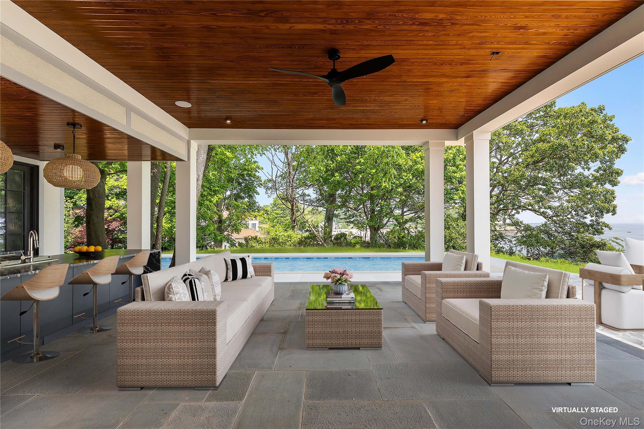 104 Premium Point Larchmont, NY 10538 - Photo 16 of 36 a balcony with furniture and a garden