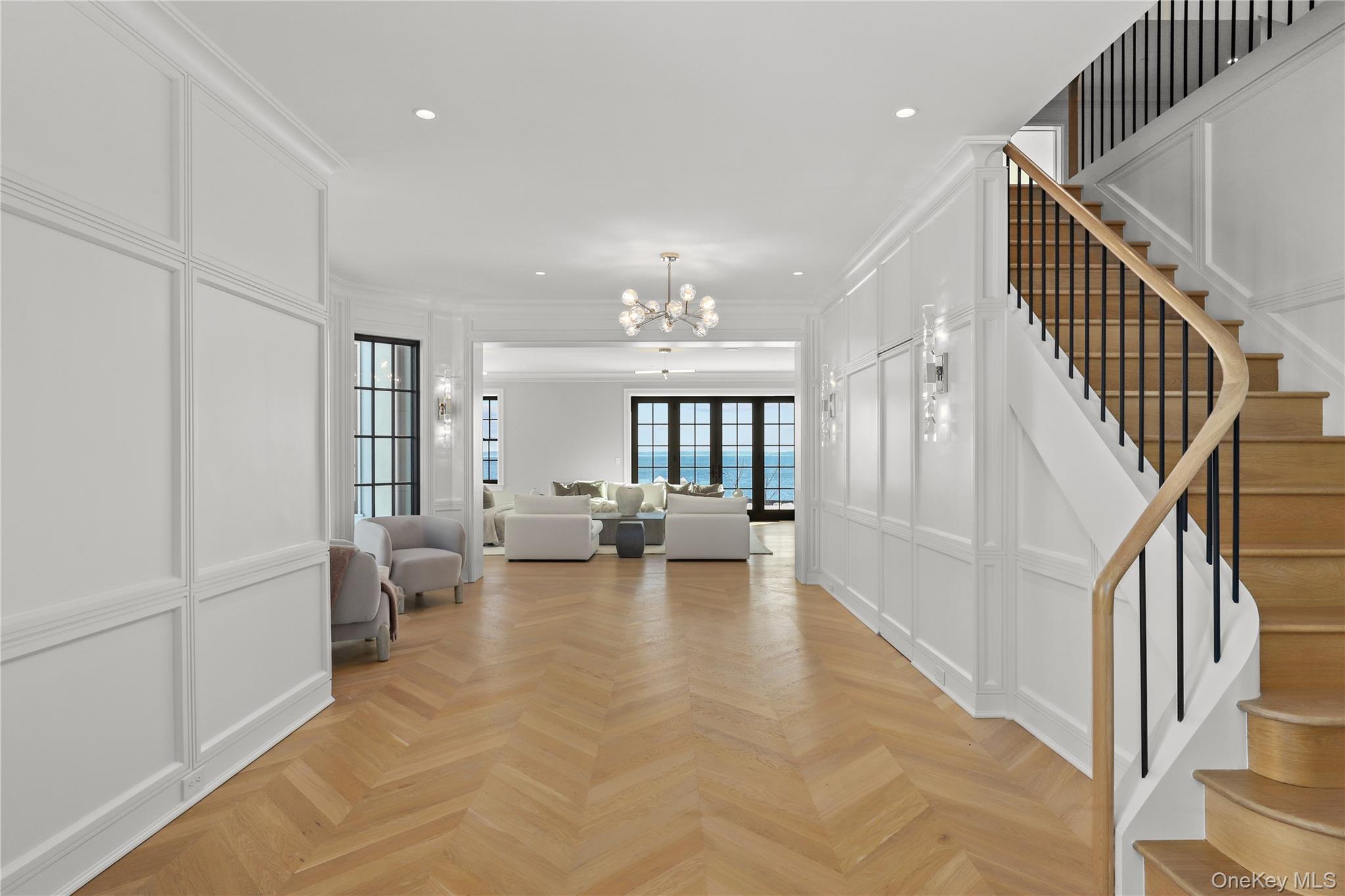 104 Premium Point Larchmont, NY 10538 - Photo 18 of 41 a very nice looking living room with white walls and a couch