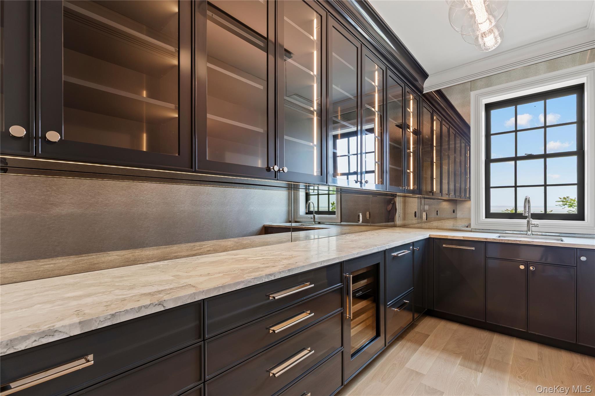 104 Premium Point Larchmont, NY 10538 - Photo 19 of 36 a kitchen with a sink and cabinets