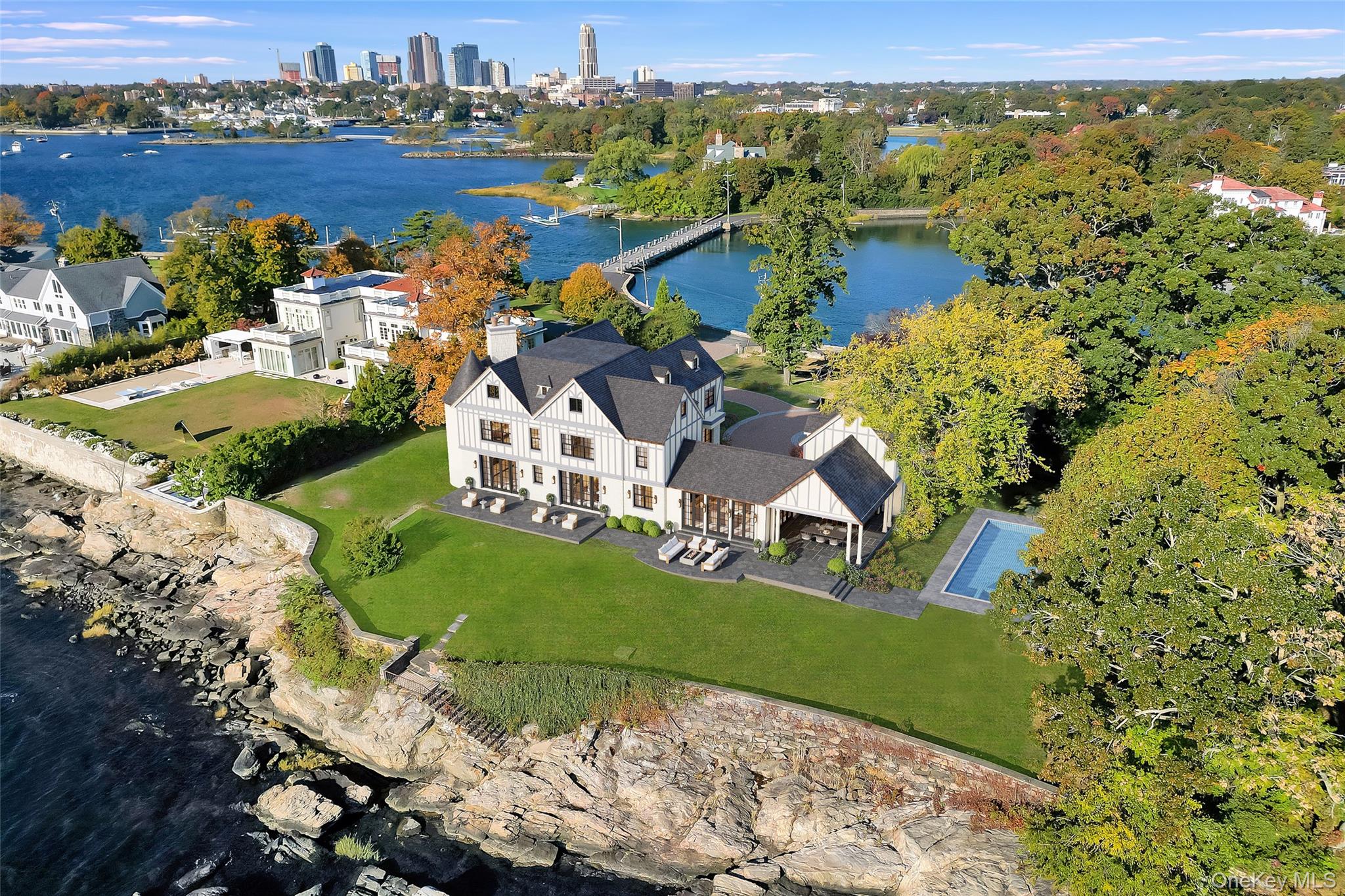 104 Premium Point Larchmont, NY 10538 - Photo 2 of 41 an aerial view of a house with a lake view