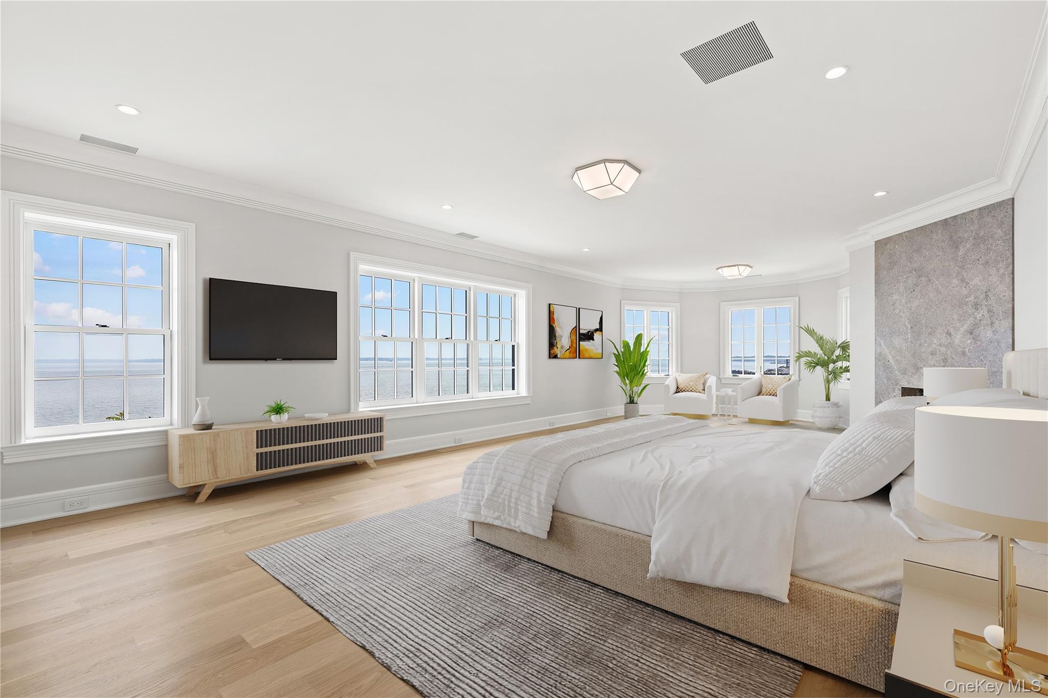 104 Premium Point Larchmont, NY 10538 - Photo 22 of 36 a bedroom with a bed and large windows